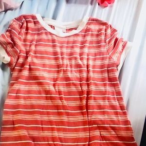 I'm selling a light red colored shirt with stripes size medium in kids!